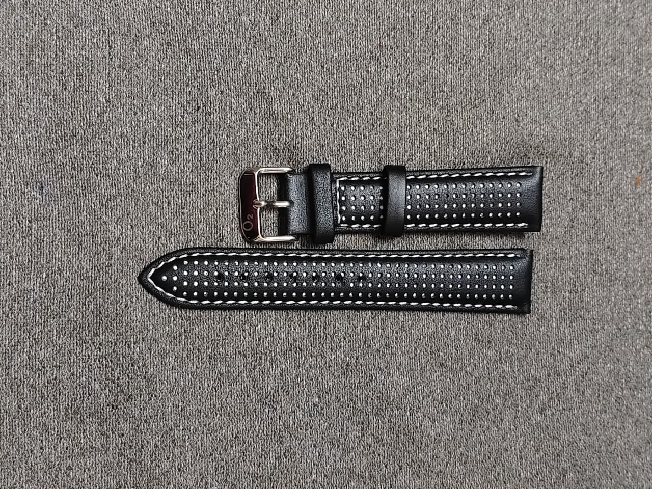 Black perforated Italian leather racing watch strap with white stitching and stainless steel buckle, available in 20mm, 22mm, and 24mm sizes