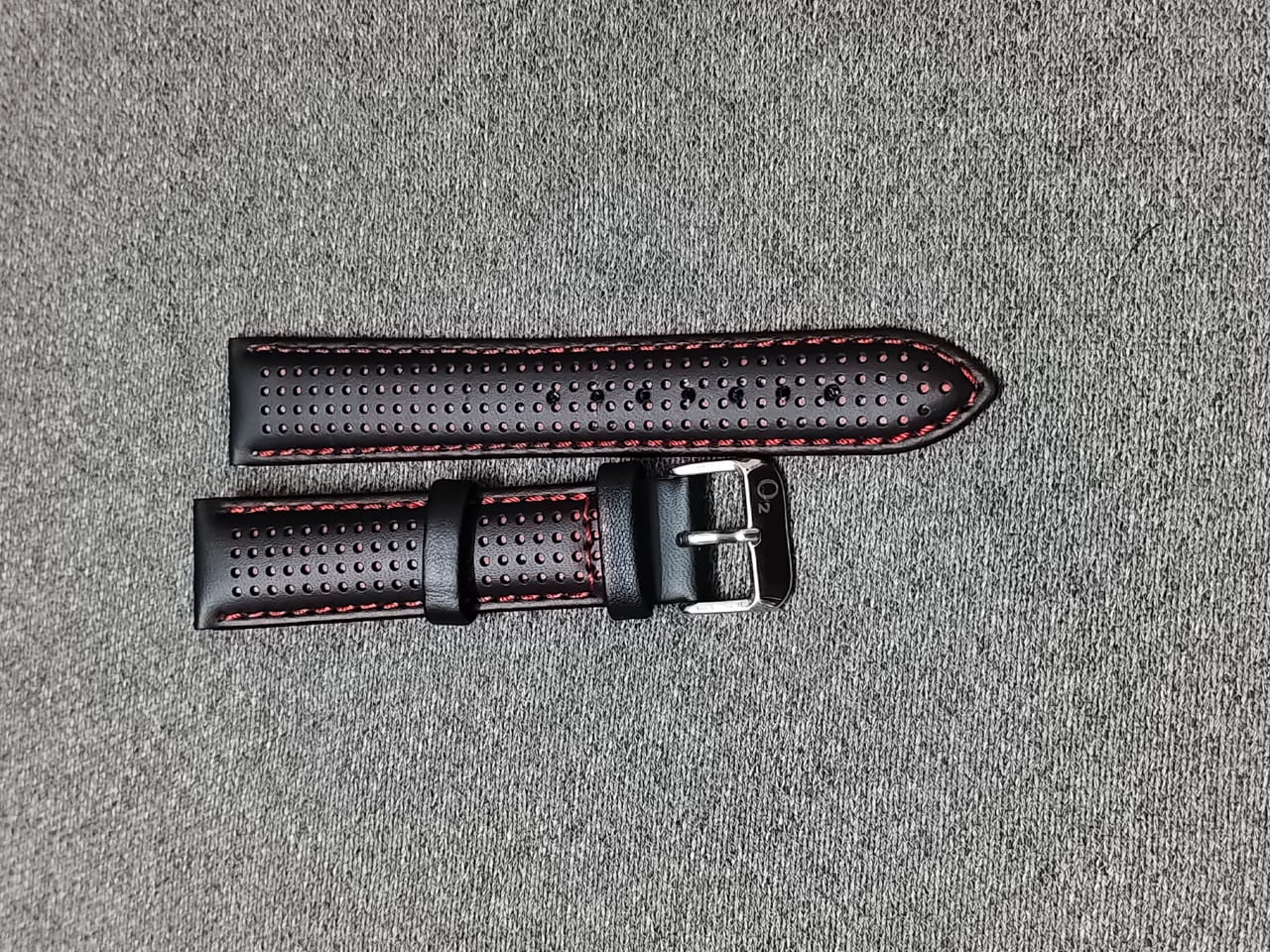 Black perforated Italian leather racing watch strap with Red stitching and stainless steel buckle, available in 20mm, 22mm, and 24mm sizes