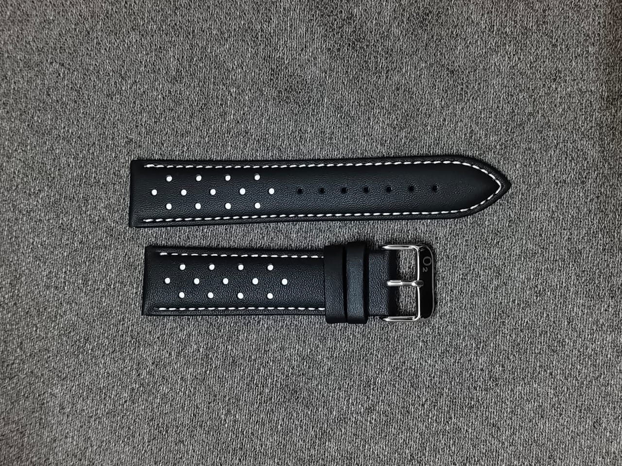 Black Italian leather racing watch strap with white stitching, perforated design, and stainless steel buckle in 20mm, 22mm, and 24mm sizes