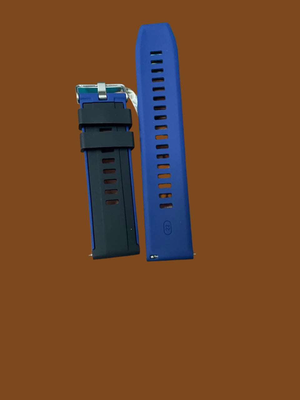 Black silicone watch strap with blue inner lining, blue edge accents, and quick-release spring bars – 22mm width